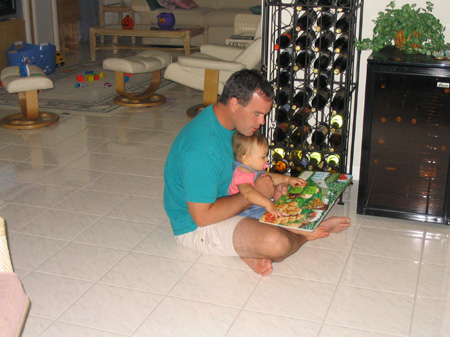 Daddy reads a story to Ella
