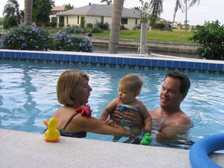 Grandma Daddy and Ella play in the pool